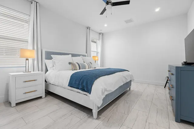 a bedroom with a bed and a dresser