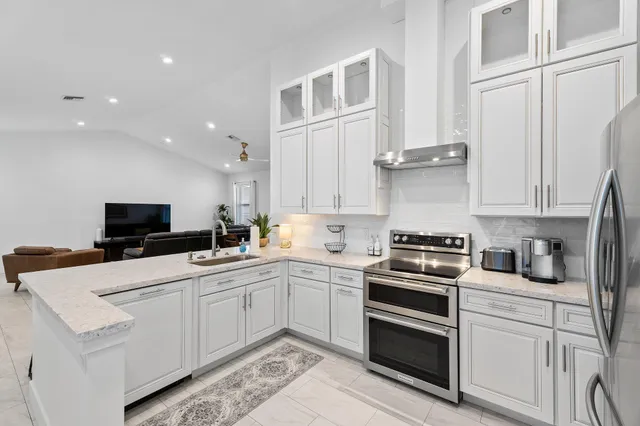 a kitchen with cabinets and appliances