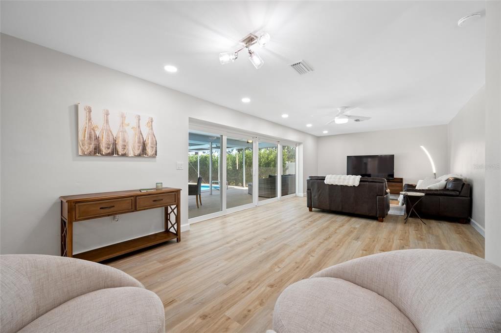 656 Mehlenbacher Road Belleair, FL 33756 - Photo 14 of 49 a living room with furniture and a flat screen tv