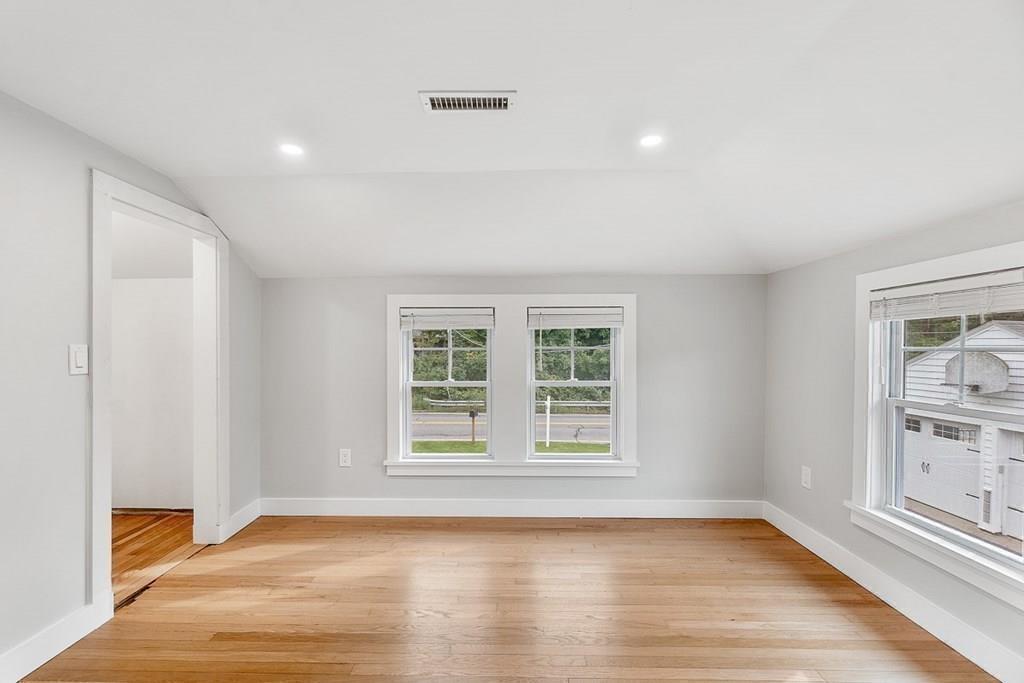 68 Still River Road Harvard, MA 01451 - Photo 35 of 40 an empty room with wooden floor and window