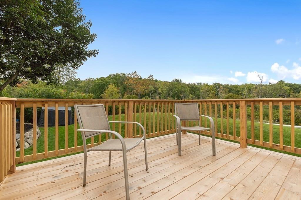 68 Still River Road Harvard, MA 01451 - Photo 37 of 40 a view of a balcony with wooden floor and fence