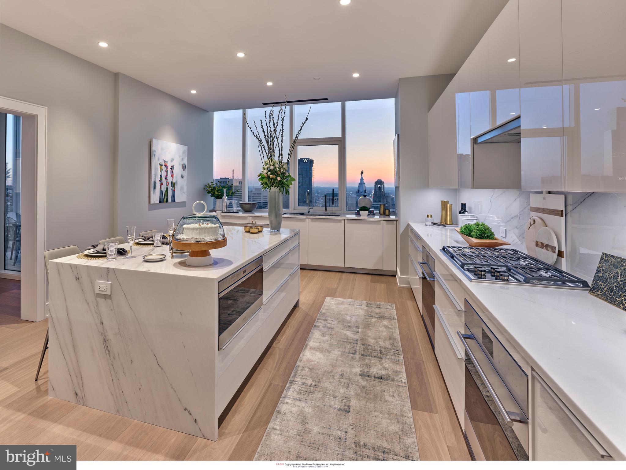 301 South Broad Street, Unit 4101 Philadelphia, PA 19107 - Photo 4 of 23 Lincoln Calcatta countertops with waterfall edge