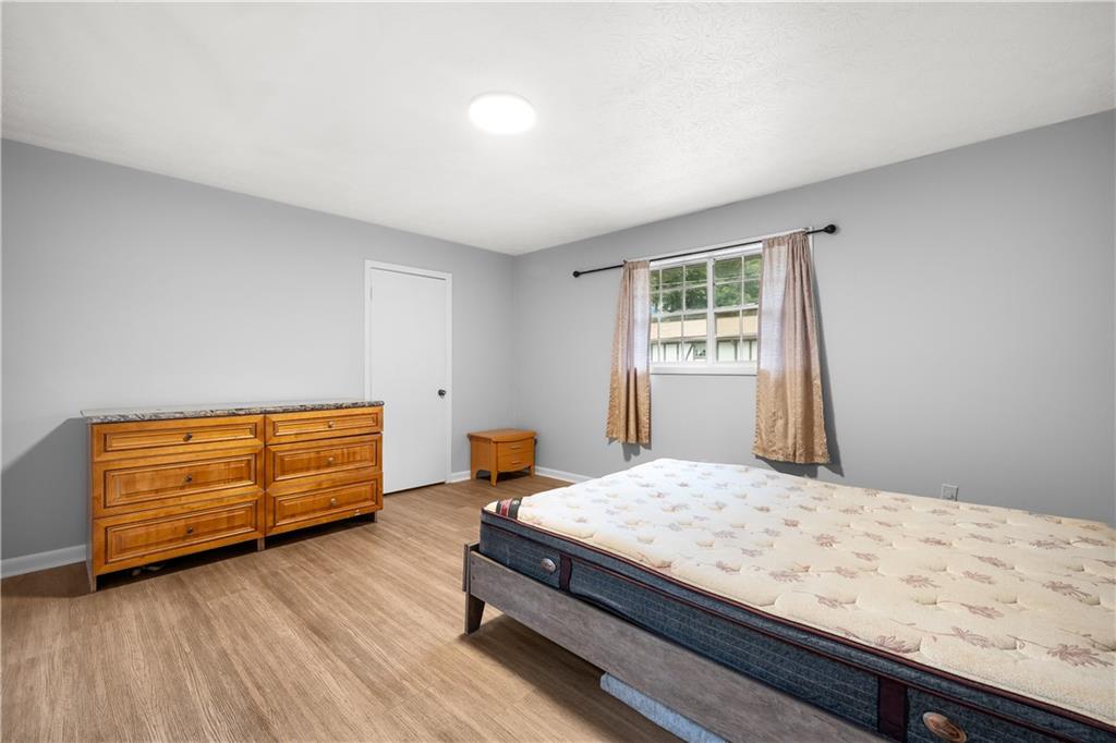 2956 North Dekalb Drive, Unit C Atlanta, GA 30340 - Photo 16 of 25 a bedroom with a bed and window