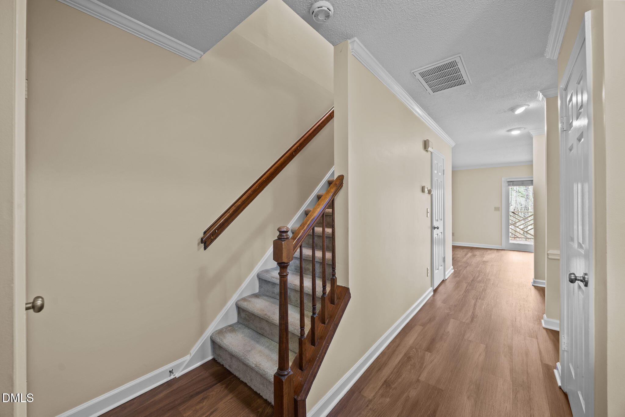 3112 Coachman's Way Durham, NC 27705 - Photo 10 of 29 a view of a hallway with wooden floor and staircase