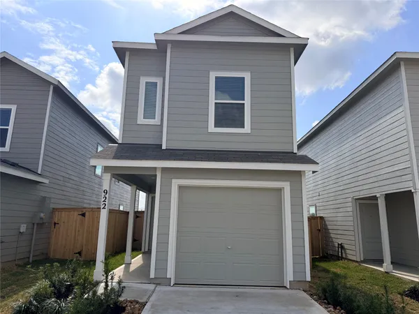 a front view of a house with garage