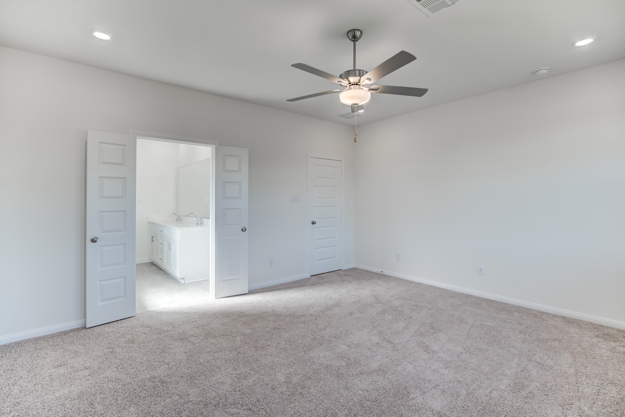 20630 Dynamic Court Humble, TX 77338 - Photo 15 of 28 an empty room with chandelier fan and closet area