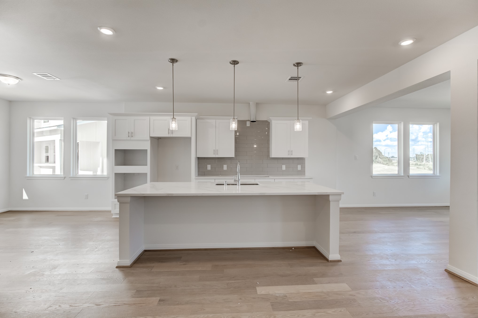 20630 Dynamic Court Humble, TX 77338 - Photo 8 of 28 a large kitchen with kitchen island a sink stainless steel appliances and cabinets