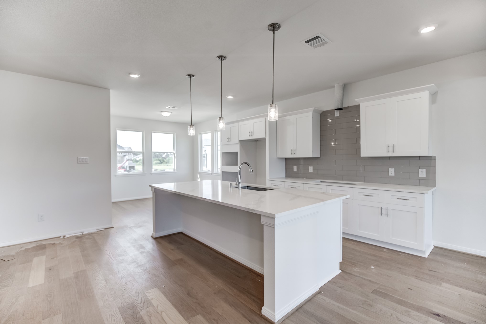 20630 Dynamic Court Humble, TX 77338 - Photo 9 of 28 a large kitchen with kitchen island a sink stainless steel appliances and cabinets