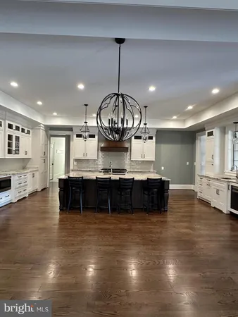 a kitchen with a table and chairs in it