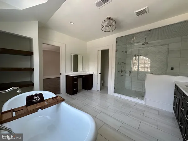 a large bathroom with a mirror and a sink
