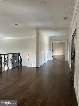 a view of wooden floor with a window