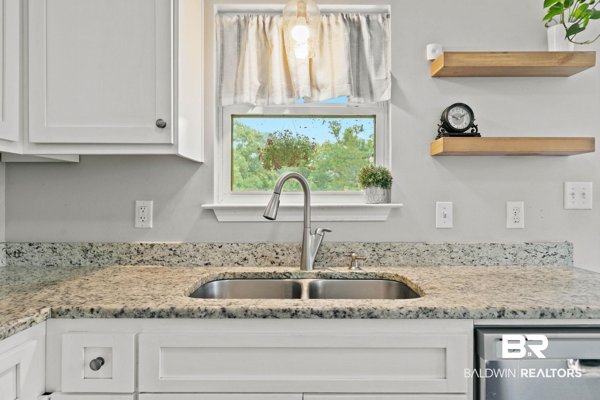 22810 High Ridge Road Fairhope, AL 36532 - Photo 31 of 78 Kitchen featuring a double basin stainless steel sink, granite countertops, white cabinetry with dark hardware, and a stainless steel dishwasher
