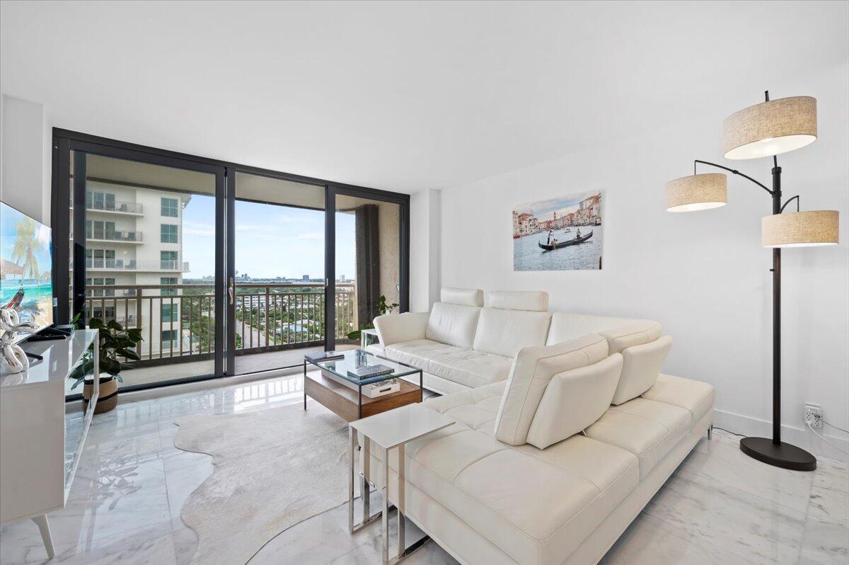 3400 North Ocean Drive, Unit 1806 Singer Island, FL 33404 - Photo 17 of 55 a living room with furniture and a floor to ceiling window