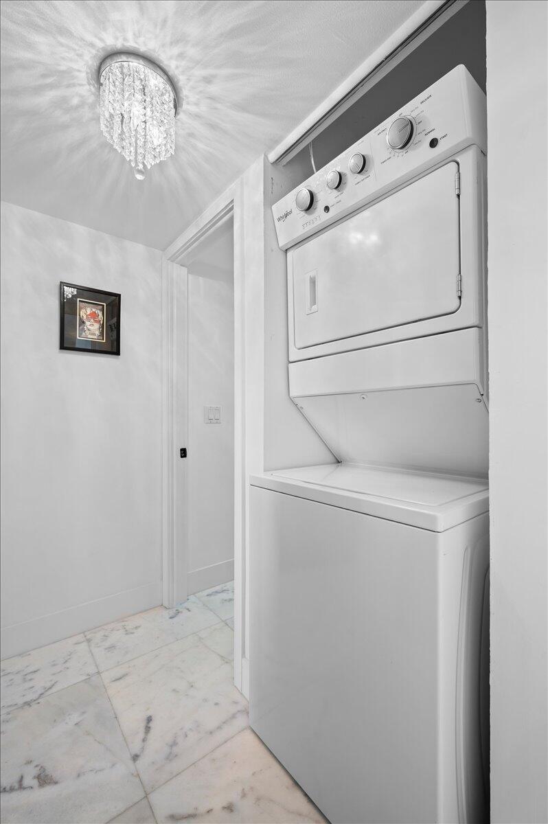 3400 North Ocean Drive, Unit 1806 Singer Island, FL 33404 - Photo 18 of 55 a utility room with dryer and washer