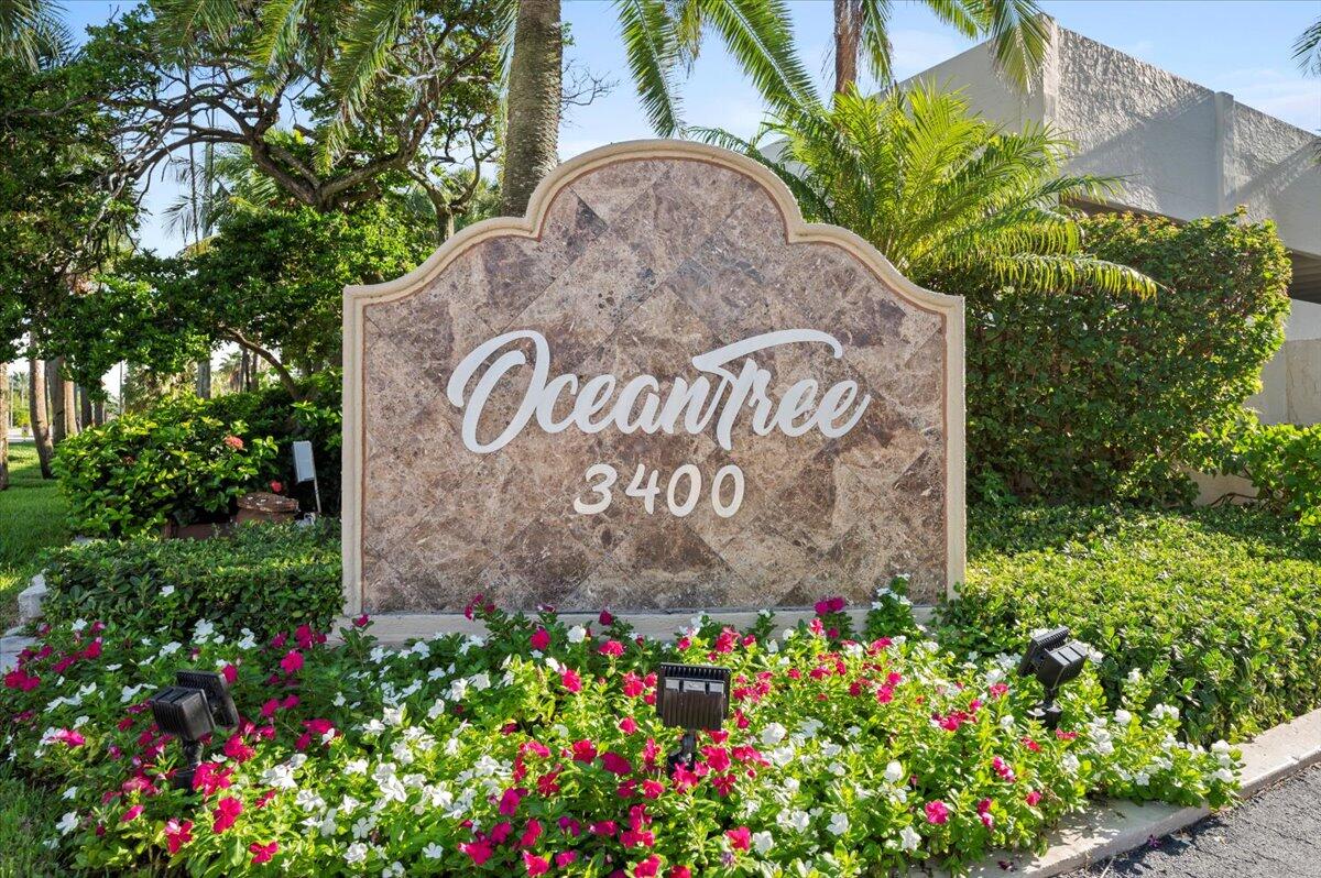 3400 North Ocean Drive, Unit 1806 Singer Island, FL 33404 - Photo 35 of 55 a sign that is sitting in front of flowers