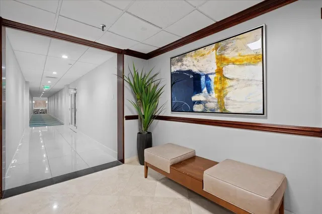 a kitchen with a sink a counter top space cabinets and stainless steel appliances