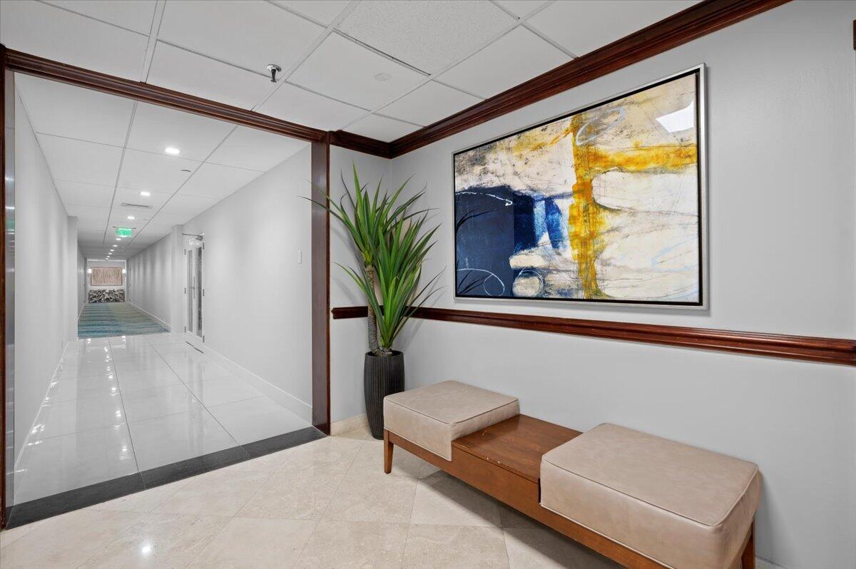 3400 North Ocean Drive, Unit 1806 Singer Island, FL 33404 - Photo 39 of 55 a living room with furniture and a potted plant