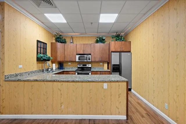 a front view of a residential apartment building with a yard