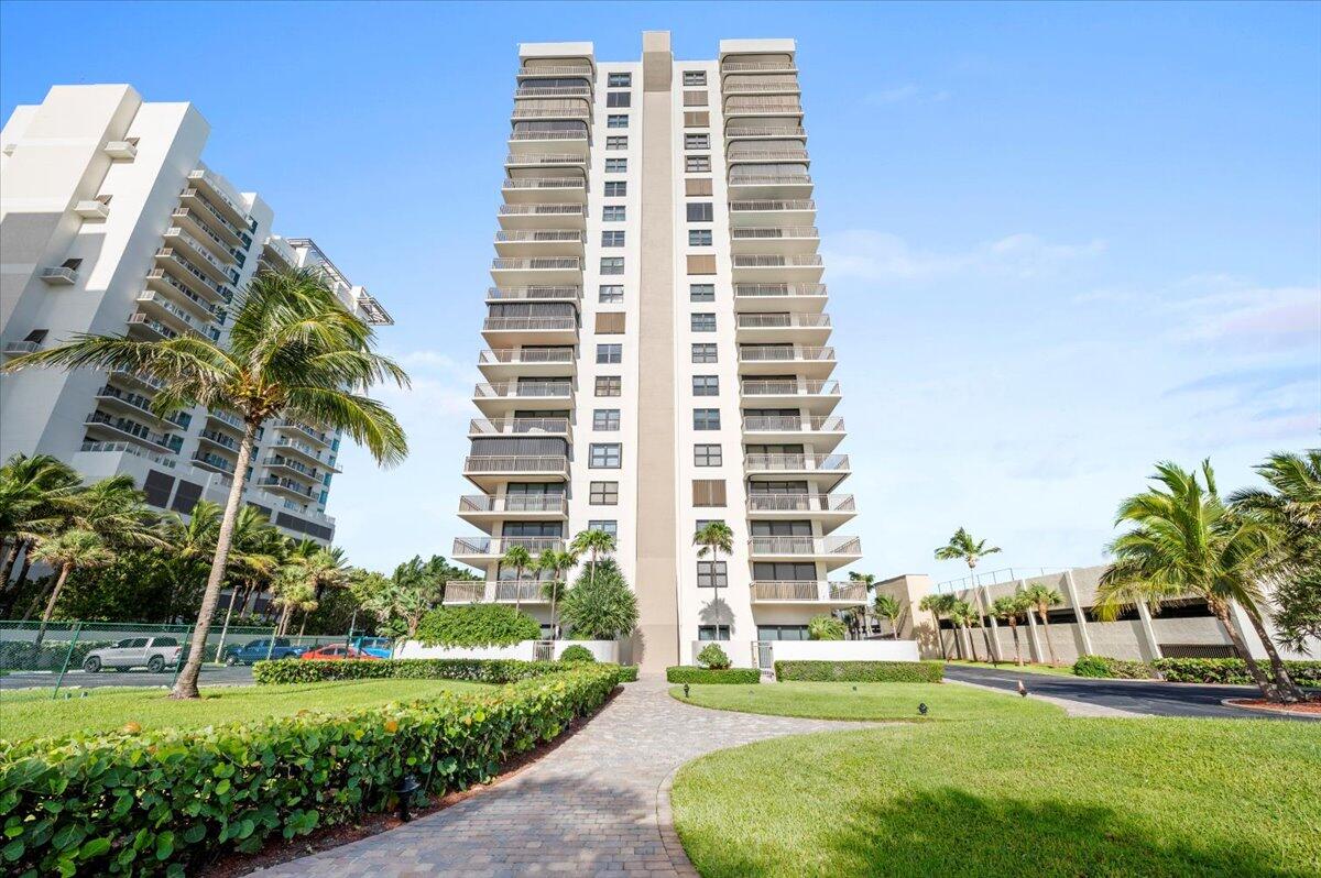 3400 North Ocean Drive, Unit 1806 Singer Island, FL 33404 - Photo 45 of 55 a front view of a residential apartment building with a yard