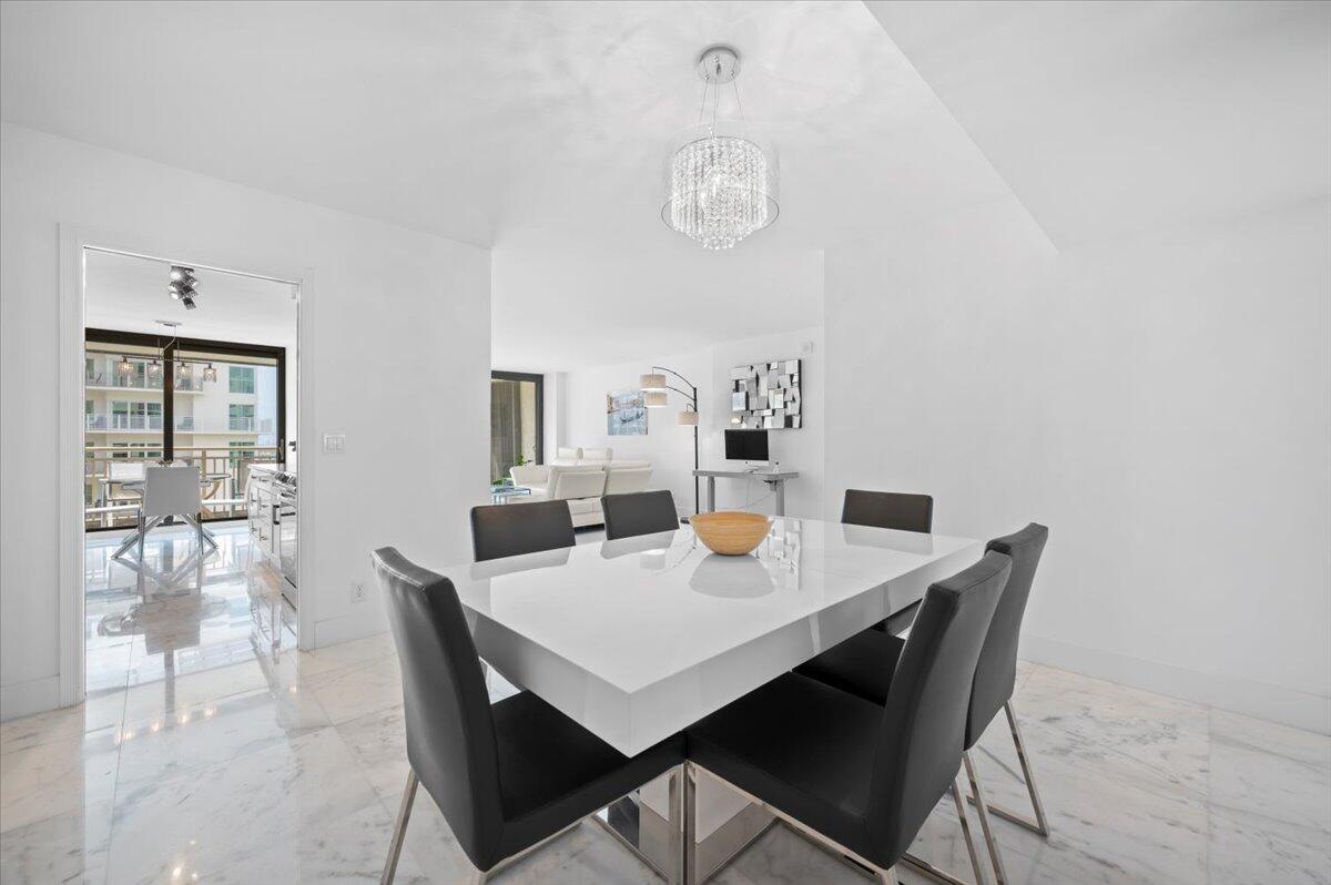 3400 North Ocean Drive, Unit 1806 Singer Island, FL 33404 - Photo 8 of 55 a view of a dining room with furniture and wooden floor