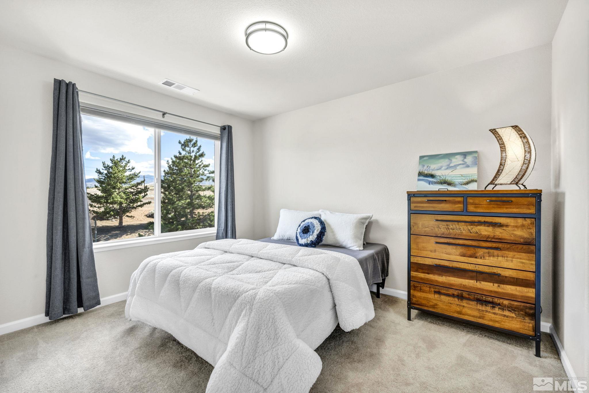 1433 Washington Street Reno, NV 89503 - Photo 31 of 35 a bedroom with a bed and a window