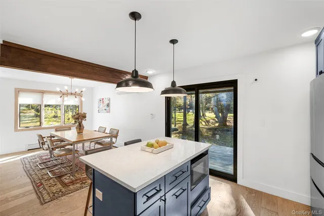 a kitchen with a sink a counter and cabinets