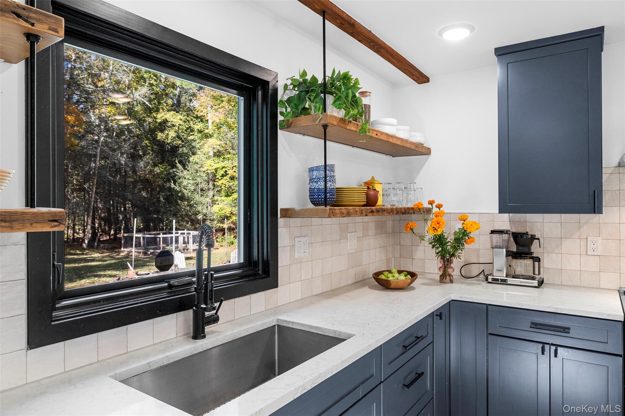 90 Van Dale Road Woodstock, NY 12498 - Photo 19 of 49 a kitchen with a sink a counter and cabinets