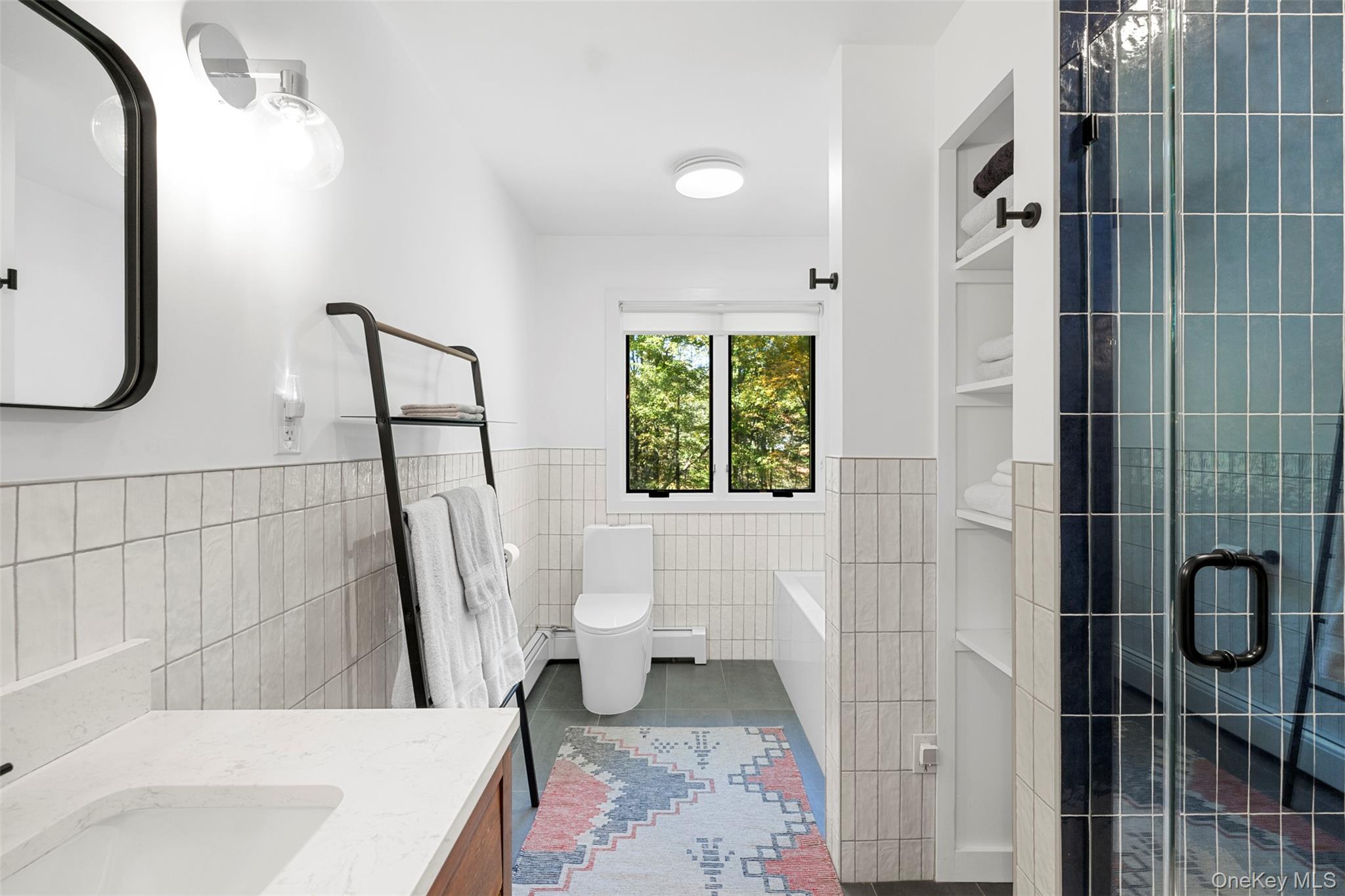 90 Van Dale Road Woodstock, NY 12498 - Photo 32 of 49 a bathroom with a sink a toilet a window and tub