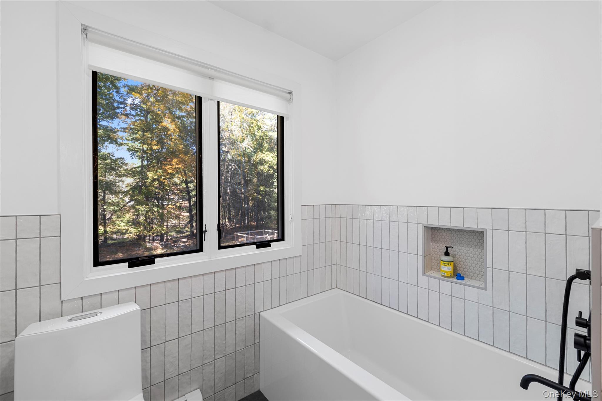 90 Van Dale Road Woodstock, NY 12498 - Photo 33 of 49 a bathroom with a bathtub and window
