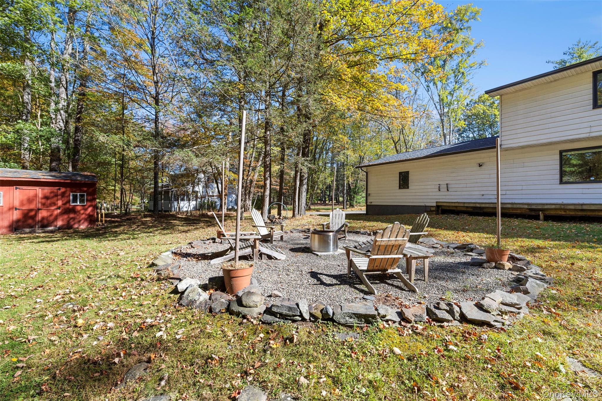 90 Van Dale Road Woodstock, NY 12498 - Photo 45 of 49 a backyard of a house with table and chairs
