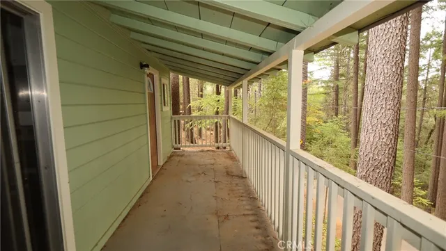 a view of a porch with wooden floor and outdoor space