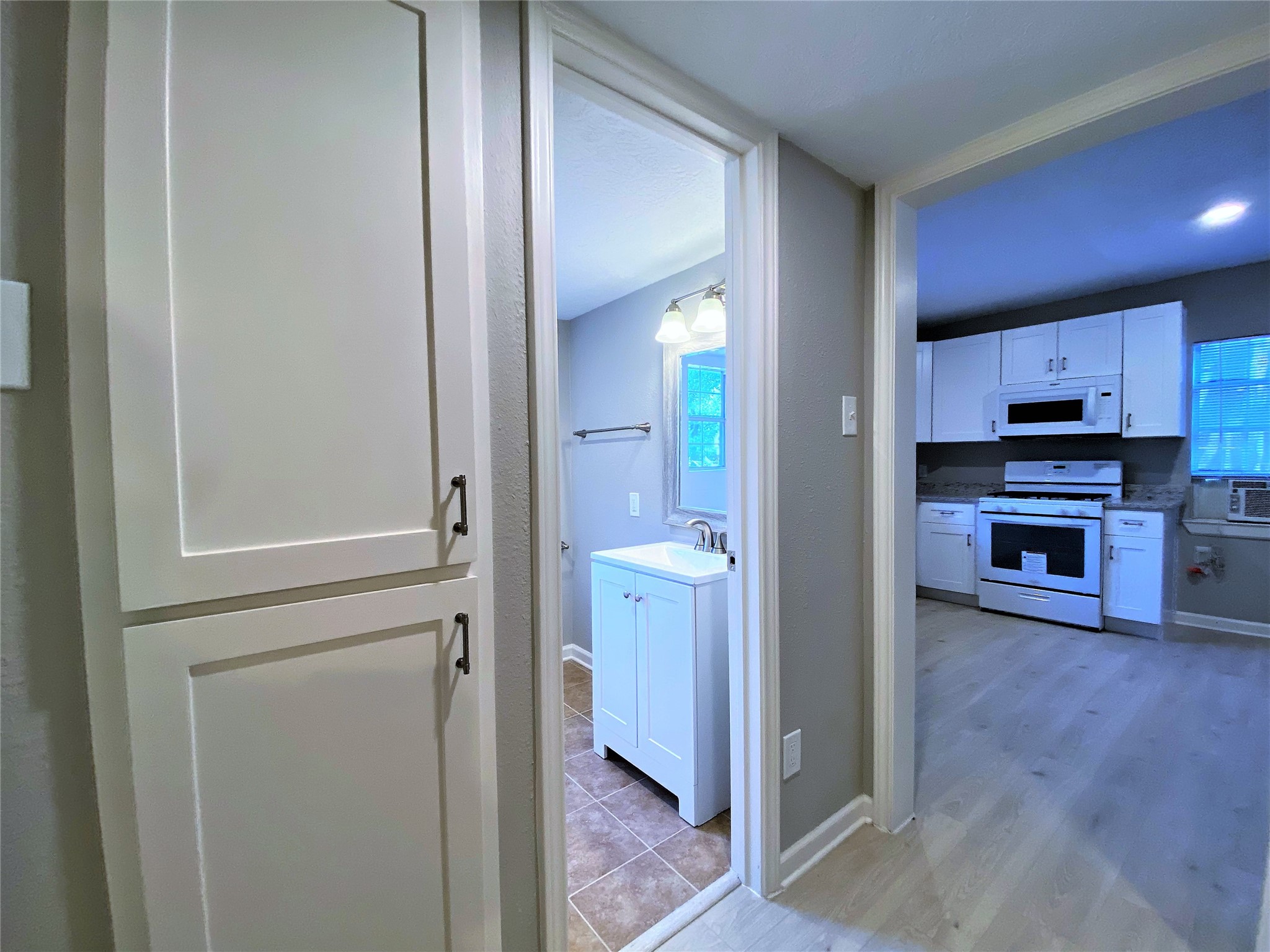 1702 Studewood Street Houston, TX 77009 - Photo 3 of 11 With linin storage in the hall way, the bath is just past the kitchen.