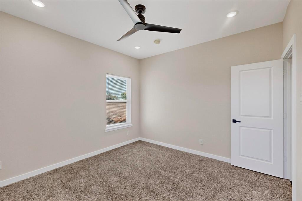 740 Section House Road Ennis, TX 75119 - Photo 23 of 31 an empty room with windows and fan