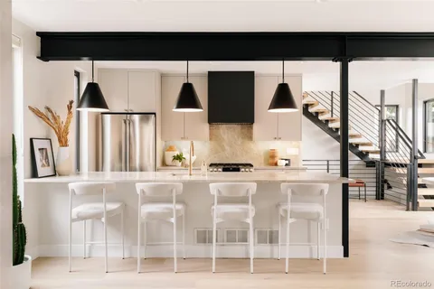 a kitchen with a table and chairs in it