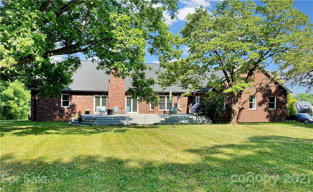 2280 Gheen Road Salisbury, NC 28147 - Photo 2 of 39 a view of a house with a big yard and large trees