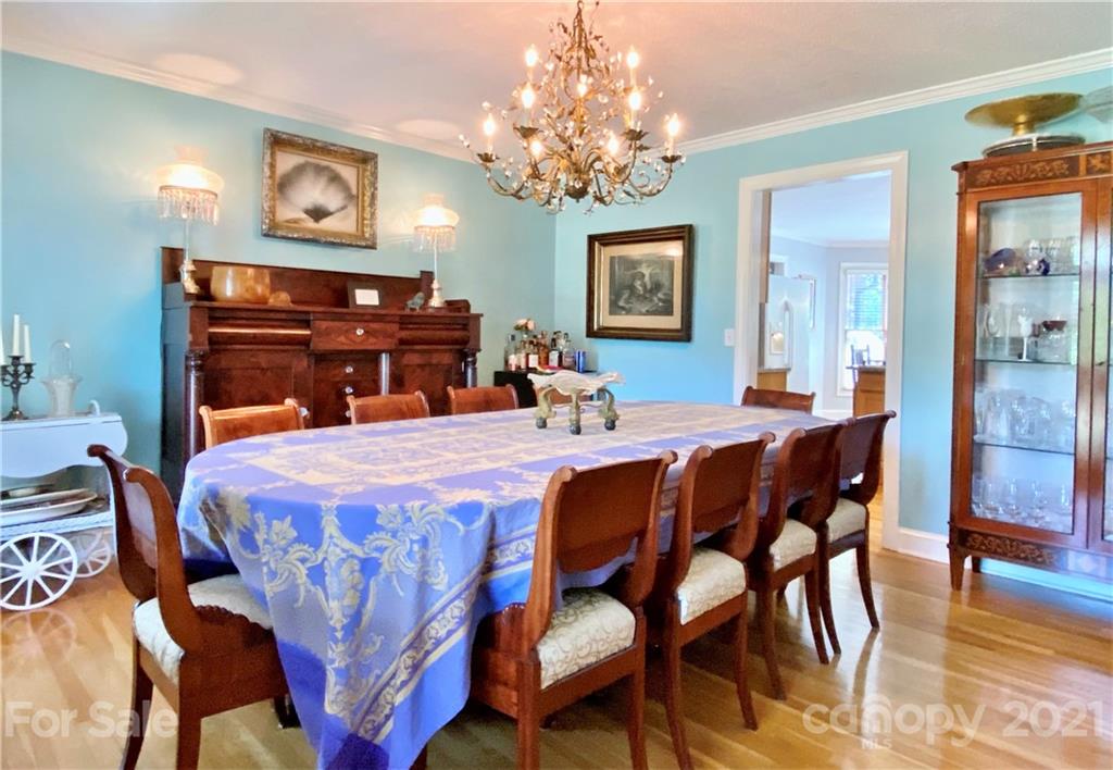 2280 Gheen Road Salisbury, NC 28147 - Photo 11 of 39 a bedroom with a bed and a chandelier