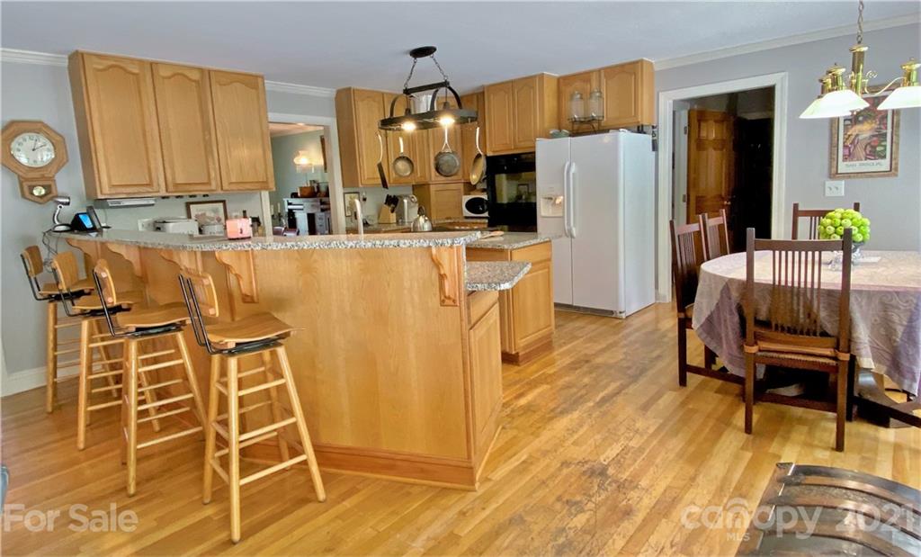 2280 Gheen Road Salisbury, NC 28147 - Photo 15 of 39 a kitchen with stainless steel appliances refrigerator dining table and chairs
