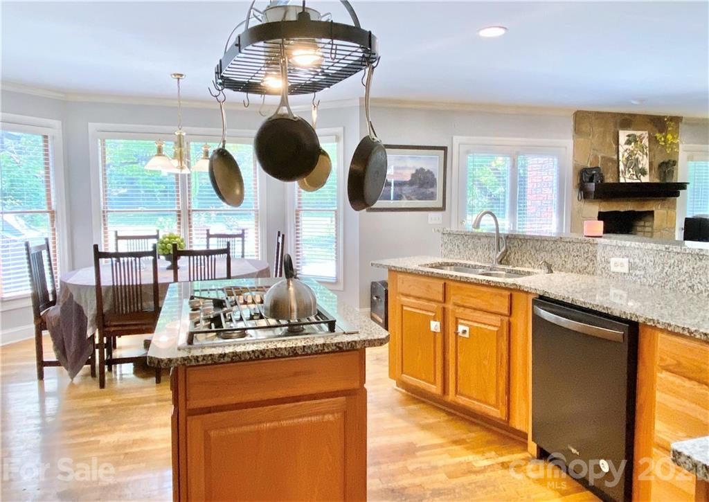 2280 Gheen Road Salisbury, NC 28147 - Photo 17 of 39 a kitchen with stainless steel appliances granite countertop a stove and a sink