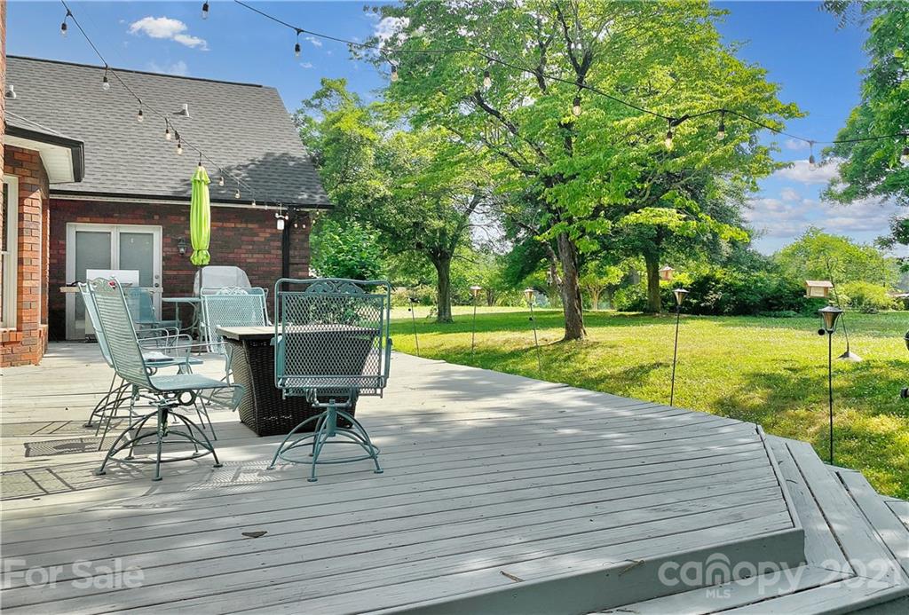 2280 Gheen Road Salisbury, NC 28147 - Photo 3 of 39 a view of a patio with table and chairs floor to ceiling yard with wooden floor and fence