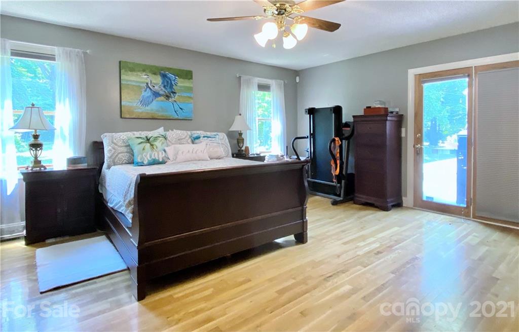 2280 Gheen Road Salisbury, NC 28147 - Photo 21 of 39 a bed room with a bed and a chandelier