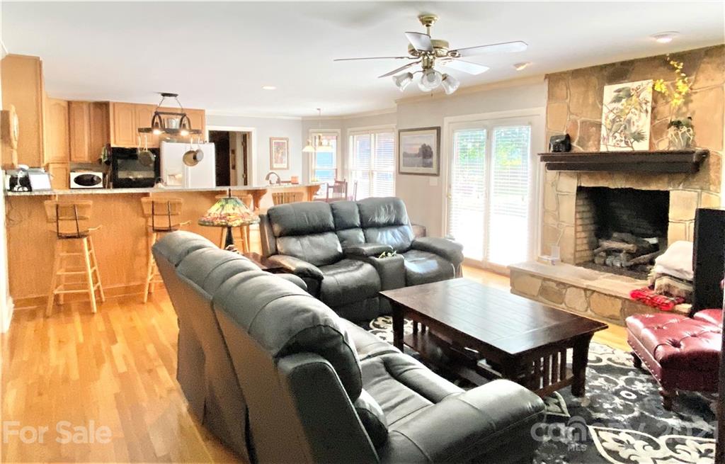 2280 Gheen Road Salisbury, NC 28147 - Photo 28 of 39 a living room with furniture kitchen view and a fireplace