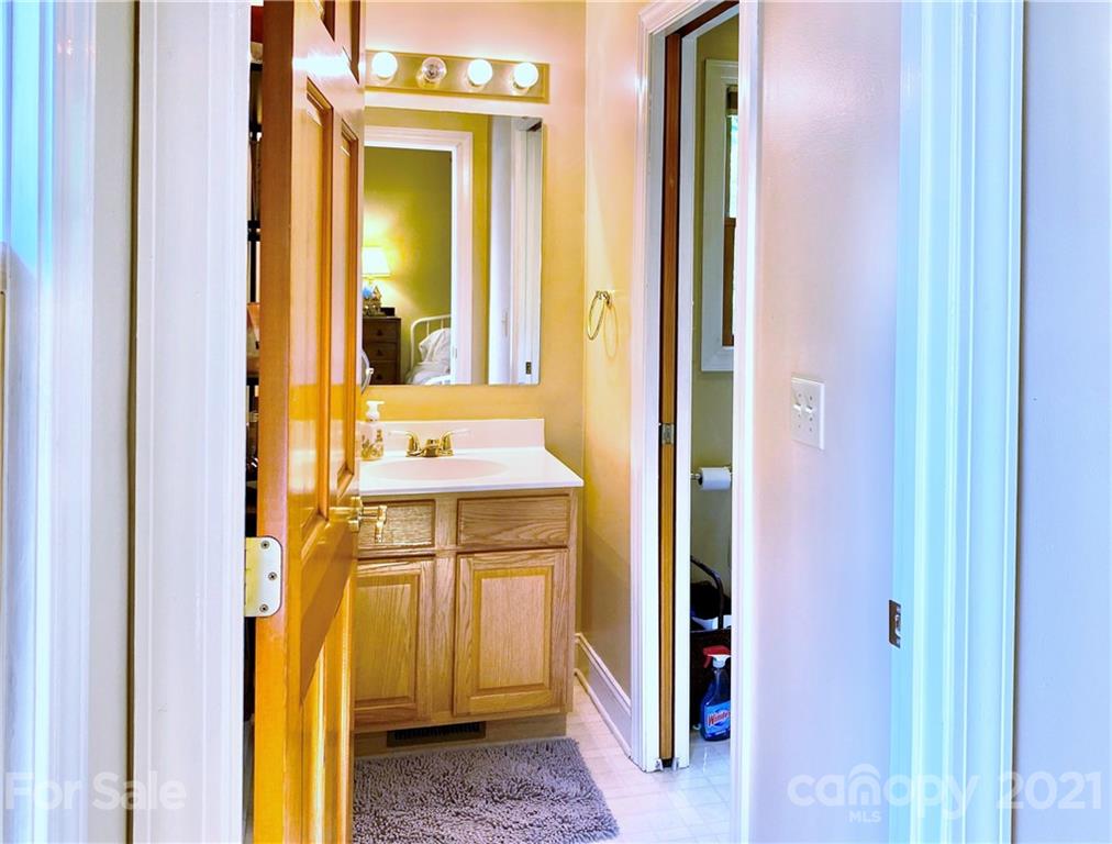2280 Gheen Road Salisbury, NC 28147 - Photo 31 of 39 a bathroom with a sink and a mirror