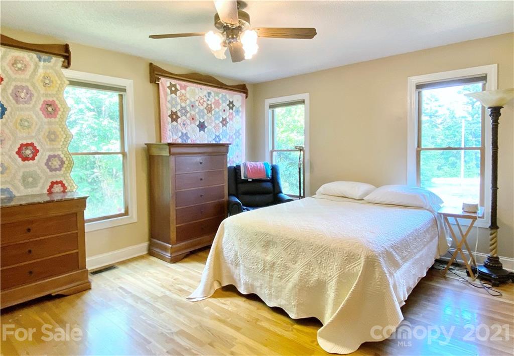 2280 Gheen Road Salisbury, NC 28147 - Photo 34 of 39 a bedroom with a bed and wooden floor