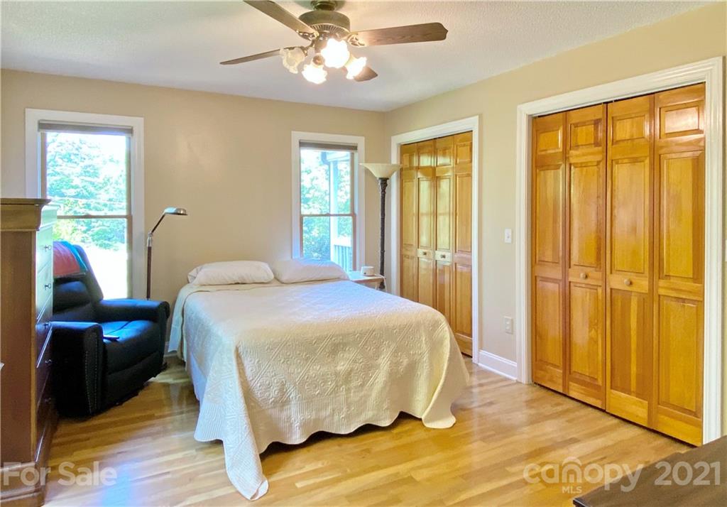 2280 Gheen Road Salisbury, NC 28147 - Photo 35 of 39 a bedroom with a bed and wooden floor