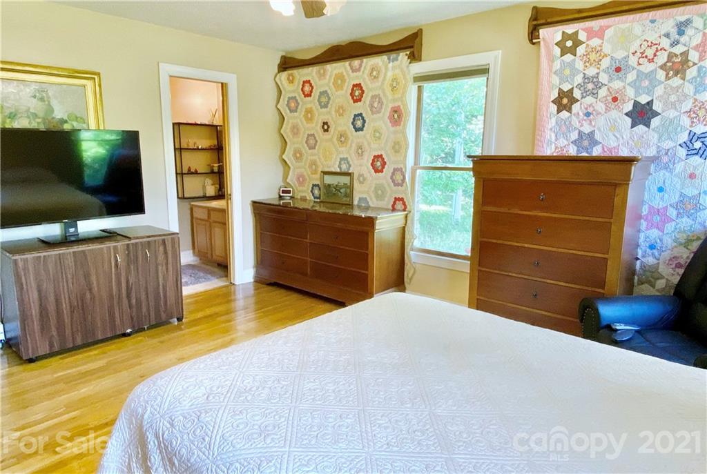 2280 Gheen Road Salisbury, NC 28147 - Photo 36 of 39 a bedroom with a bed and flat screen tv