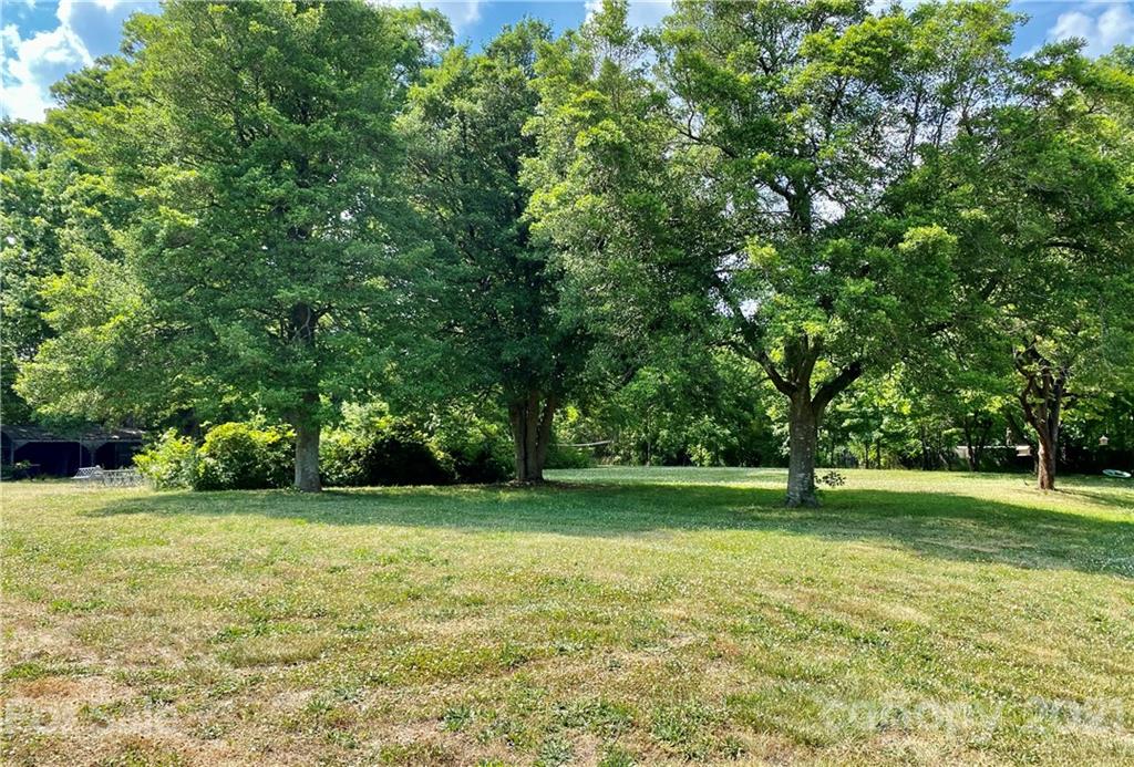 2280 Gheen Road Salisbury, NC 28147 - Photo 5 of 39 a view of a big yard with a trees