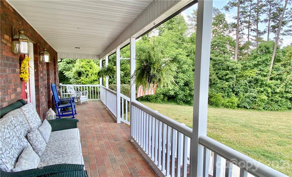 2280 Gheen Road Salisbury, NC 28147 - Photo 7 of 39 a view of a porch with furniture and wooden deck