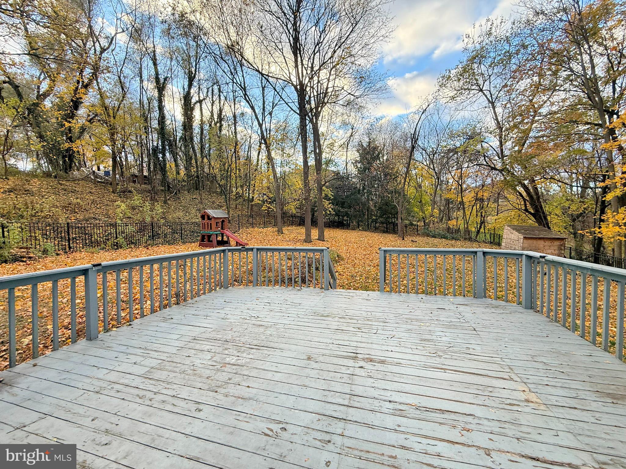 1316 Edgemont Road Harrisburg, PA 17109 - Photo 17 of 21 a view of outdoor space with deck and trees