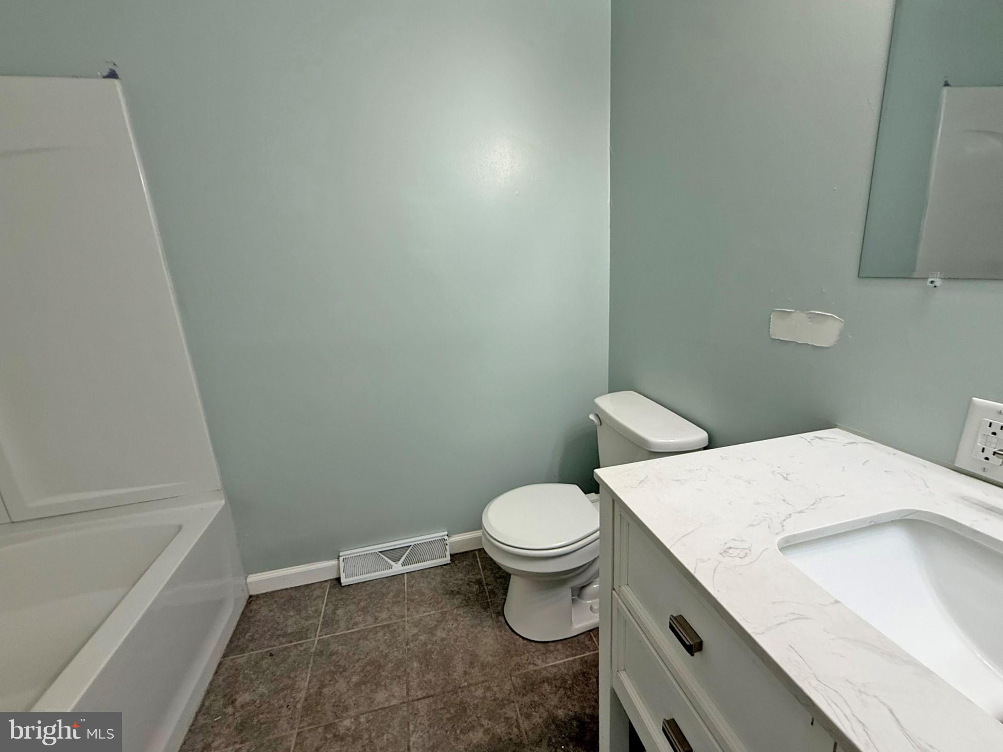1316 Edgemont Road Harrisburg, PA 17109 - Photo 5 of 21 a white toilet sitting next to a bath tub