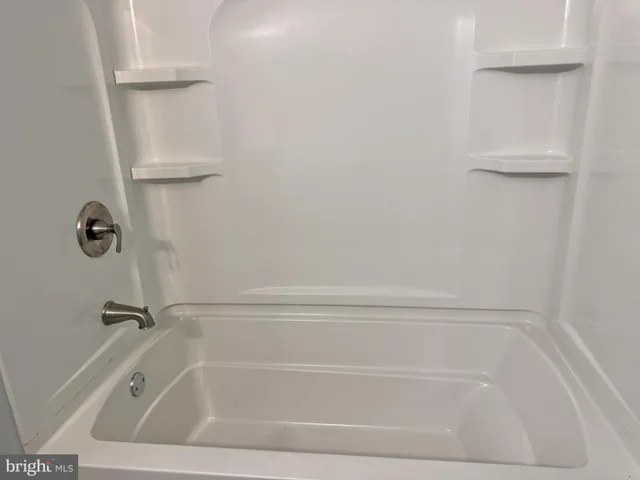 a close view of a bathtub in bathroom